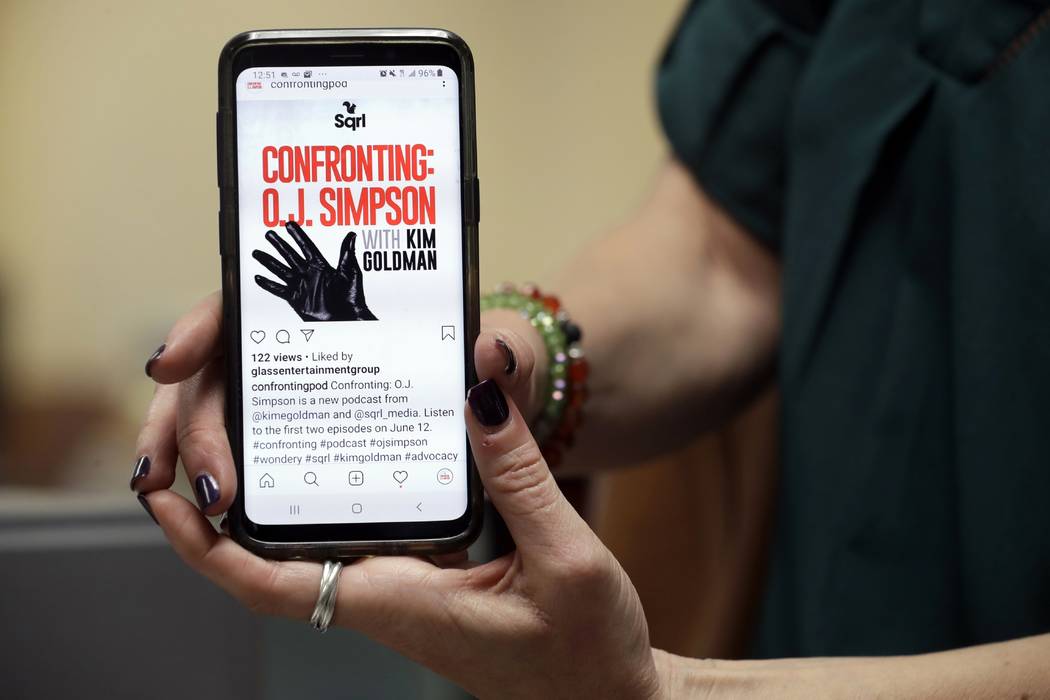 Kim Goldman holds an image of the logo for her podcast Friday, June 7, 2019, in Los Angeles. Go ...