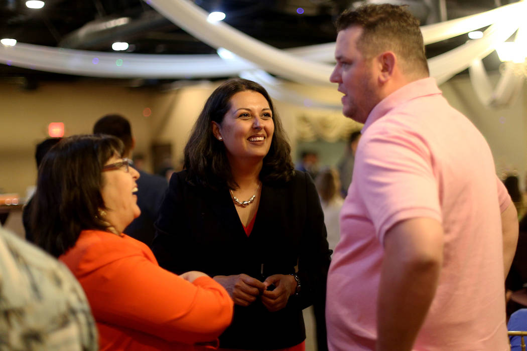 Former Assemblywoman Olivia Diaz speaks to supporters Jared Oscarson, right, and Irene Bustaman ...