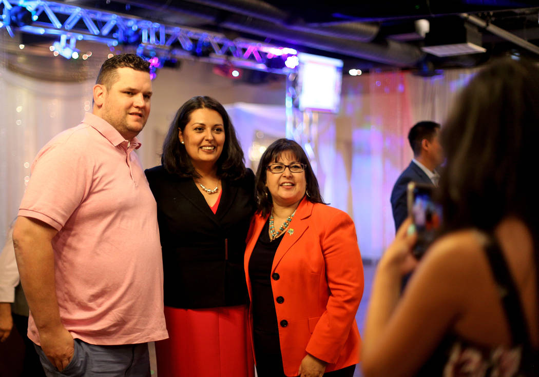 Former Assemblywoman Olivia Diaz takes a photo with supporters Jared Oscarson, left, and Irene ...