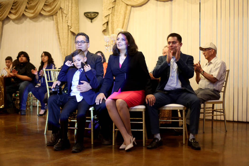 Former Assemblywoman Olivia Diaz sits with her husband Frank Alejandre, left, and their son Xav ...