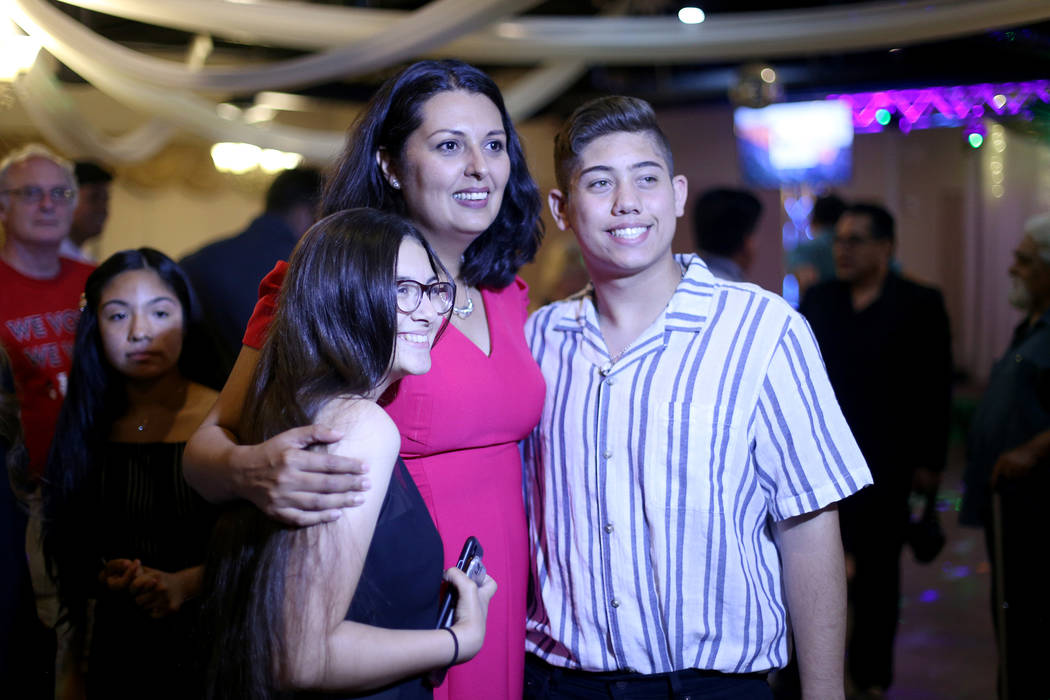 Former Assemblywoman Olivia Diaz takes a photo with Jamie Martinez, 16, left, and Griffin Morri ...