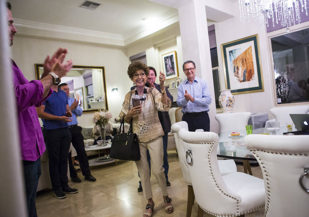 Evelyn Cannestra, center, celebrates as voting results are updated projecting Las Vegas City Co ...