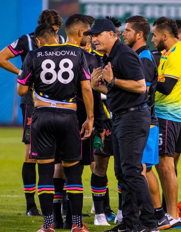 Las Vegas Lights FC forward Junior Sandoval (88) is counseled by head coach Eric Wynalda during ...