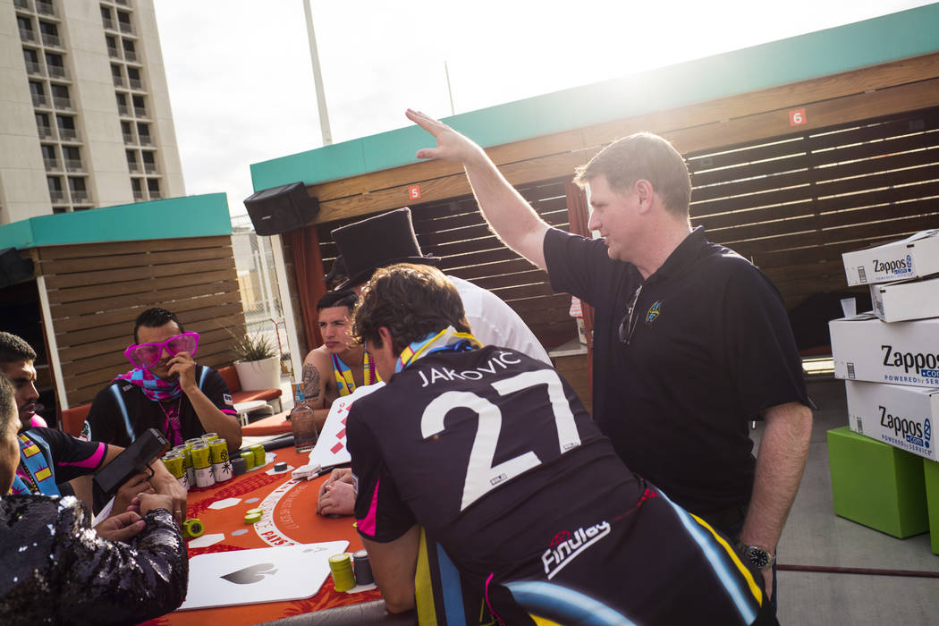 Brett Lashbrook, owner and CEO of Lights FC, talks with players ahead of the team's photo shoot ...