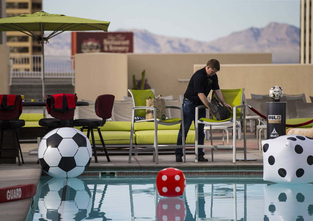 Brett Lashbrook, owner and CEO of Lights FC, helps prepare ahead of the team's photo shoot at t ...