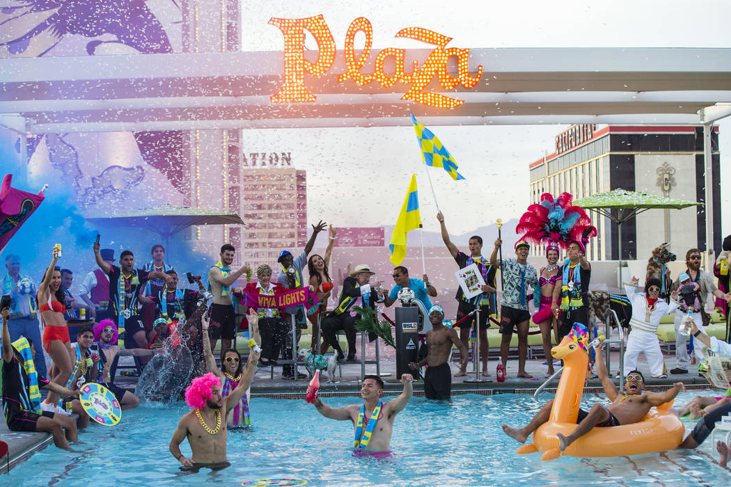 Players and special guests pose for the Lights FC team photo shoot at the Plaza in Las Vegas on ...