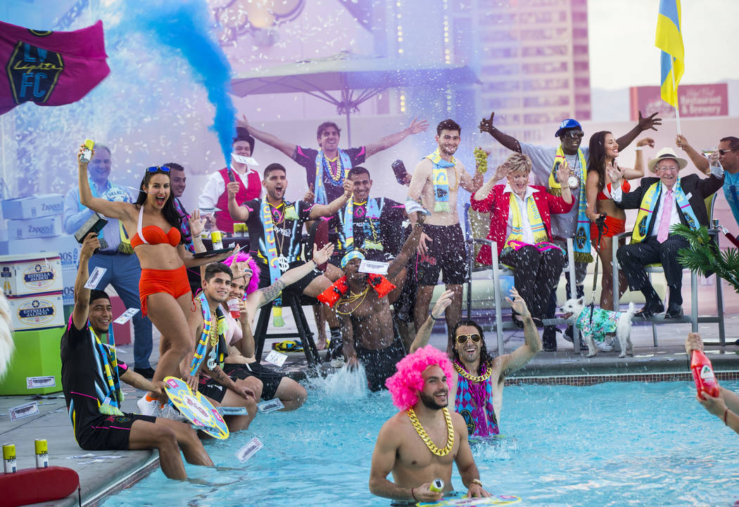 Players and special guests pose for the Lights FC team photo shoot at the Plaza in Las Vegas on ...