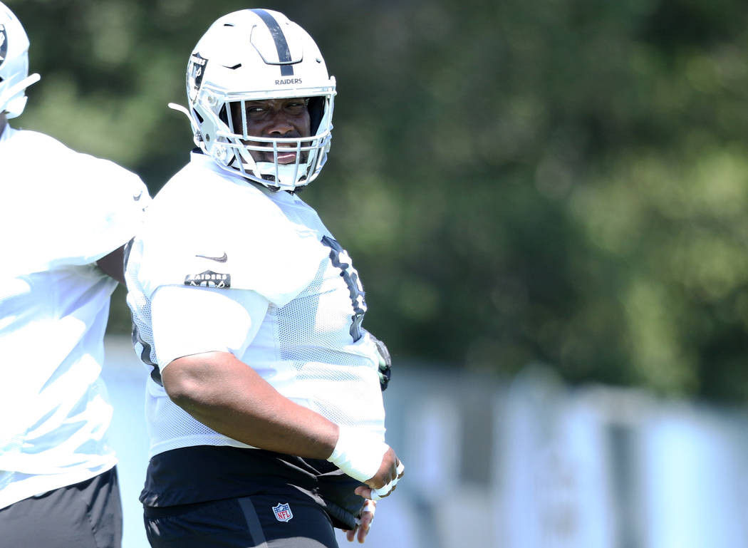 Oakland Raiders center Rodney Hudson (61) waits to drill during a mandatory mini-camp workout a ...