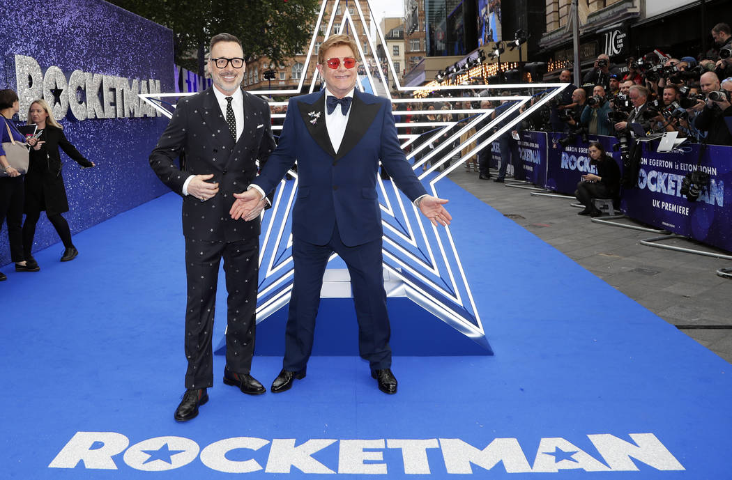 In this May 20, 2019, file photo, musician Elton John and his husband producer David Furnish, l ...