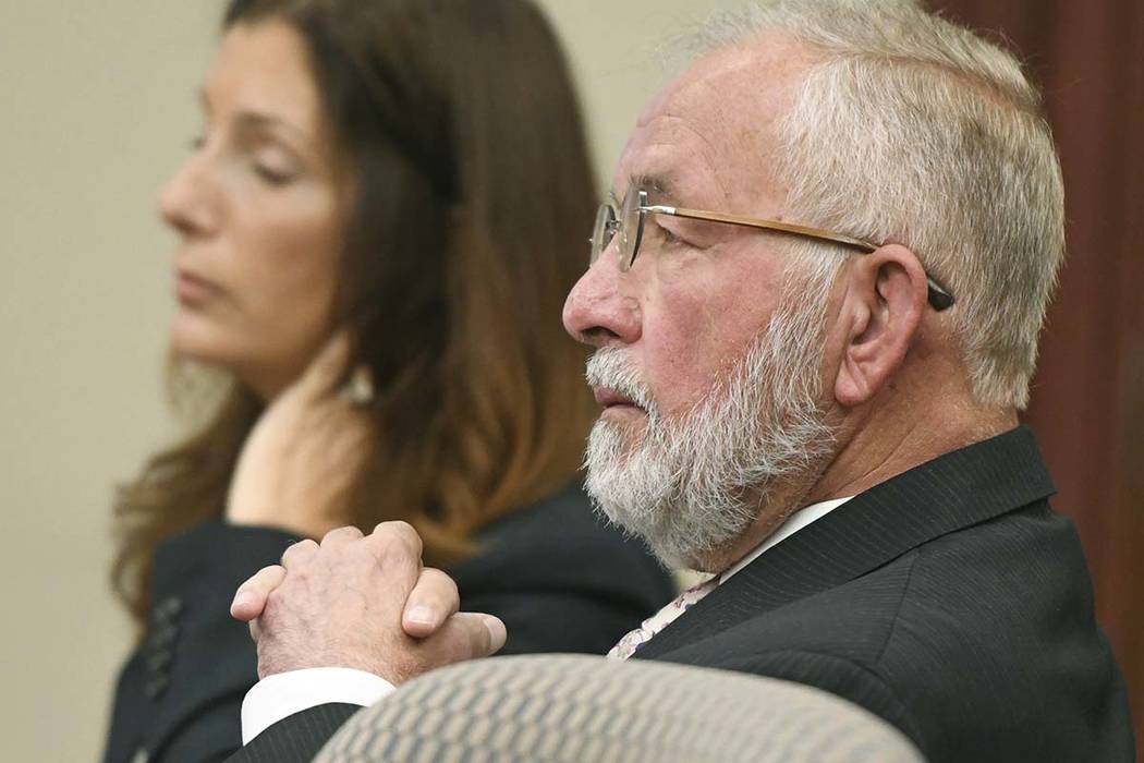 William Strampel, center, the ex-dean of MSU's College of Osteopathic Medicine and former boss ...