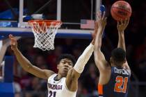 Gonzaga junior forward Rui Hachimura (21) extends to block the shot of Pepperdine senior guard ...