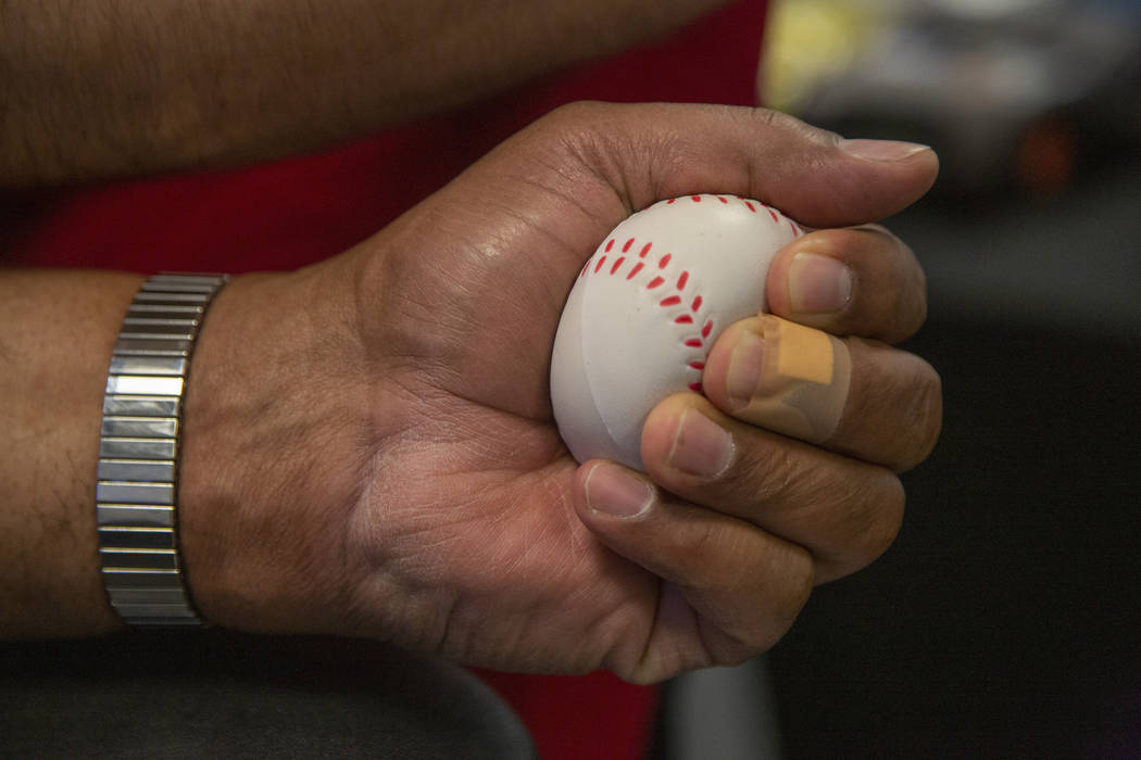 James Clark, 63, holds a pressure ball during the American Red Cross blood drive at Findlay Hon ...