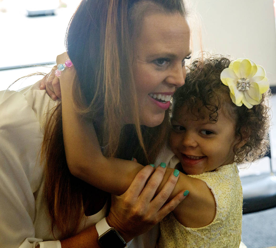 Layla O'Bryant, 4, who needs blood transfusions, hugs her mom Molly O'Bryant during the America ...