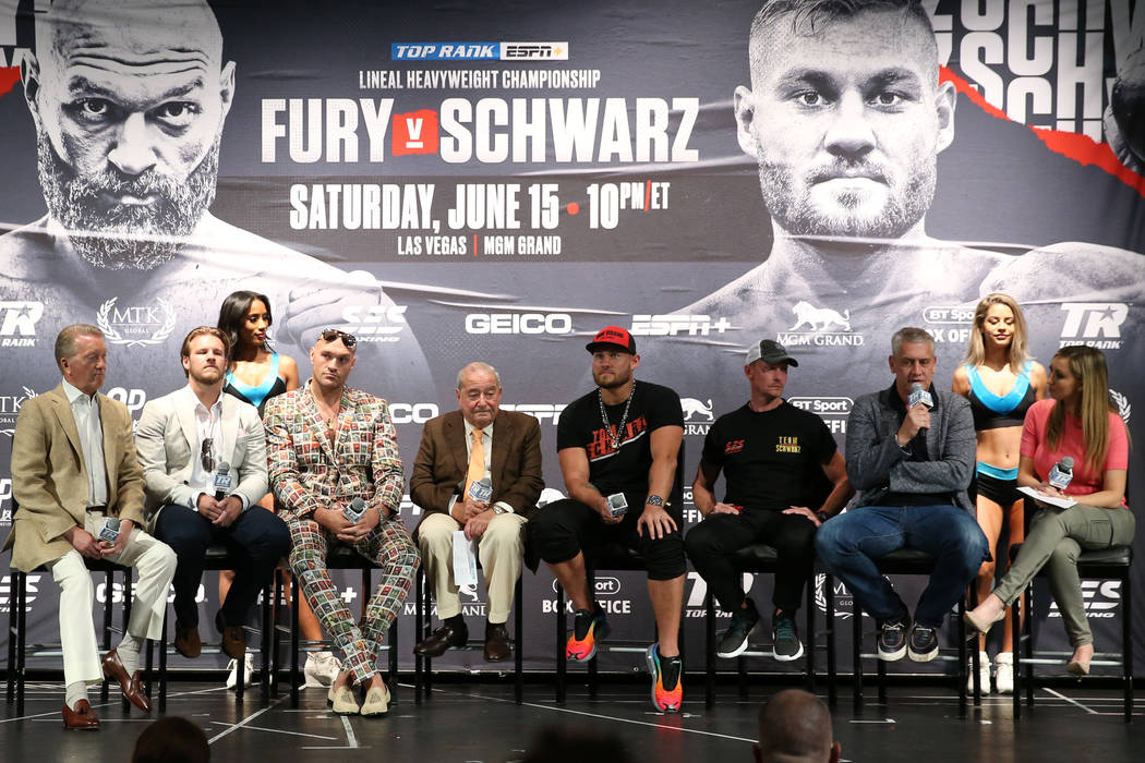Fighters and promoters participate during the final press conference for the upcoming heavyweig ...