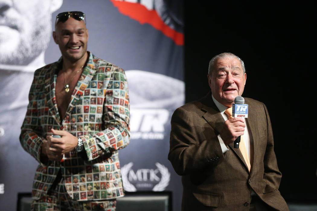 Boxer Tyson Fury, left, with promoter Bob Arum, during a press conference for his upcoming boxi ...