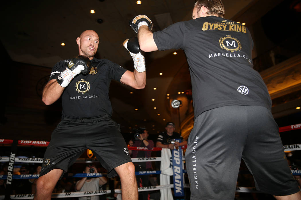 Tyson Fury, left, throws a punch during an open workout event at the MGM Grand hotel-casino in ...