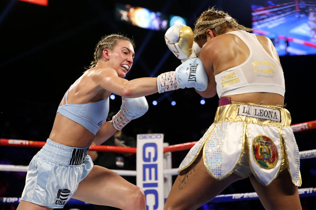 Mikaela Mayer, left, throws a punch against Lizbeth Crespo in the womenÕs super featherwei ...