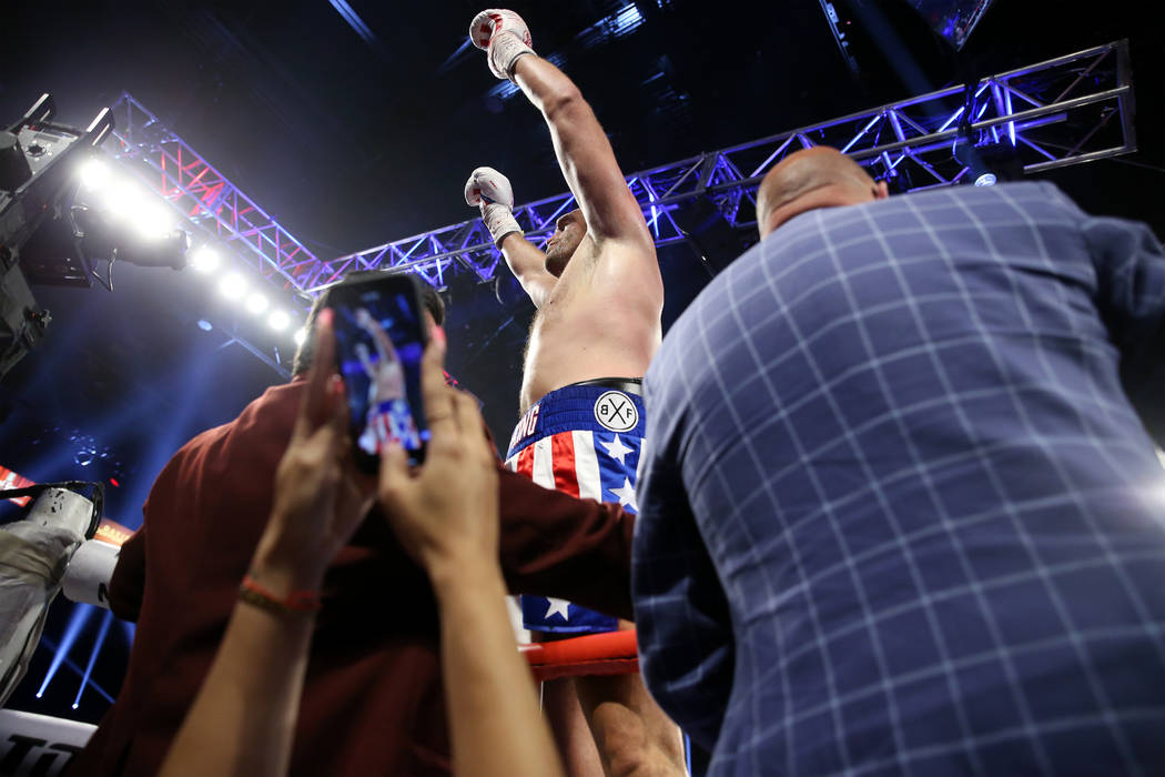 Tyson Fury celebrates his win against Tom Schwarz in the lineal heavyweight bout at the MGM Gra ...