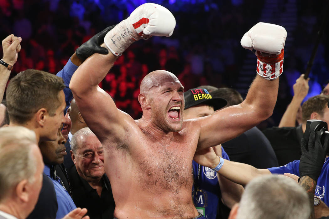 Tyson Fury celebrates his win against Tom Schwarz in the lineal heavyweight bout at the MGM Gra ...