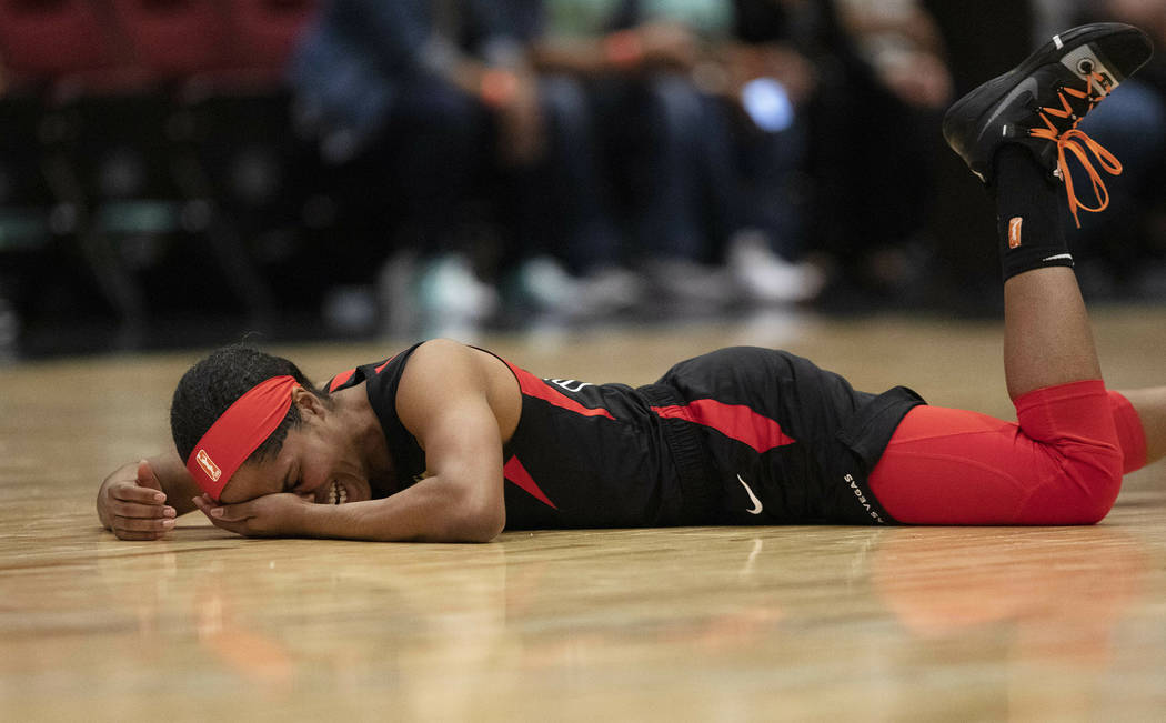 Las Vegas Aces' Sydney Colson lies on the court after being injured in the first quarter of a W ...