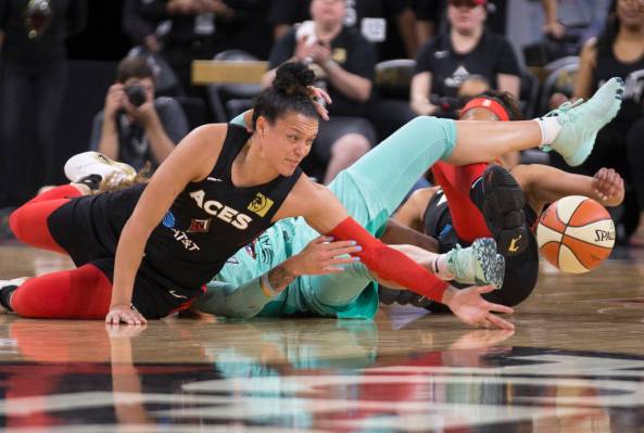 Las Vegas Aces guard Kayla McBride (21) reaches for a loose ball in the first quarter during Ve ...