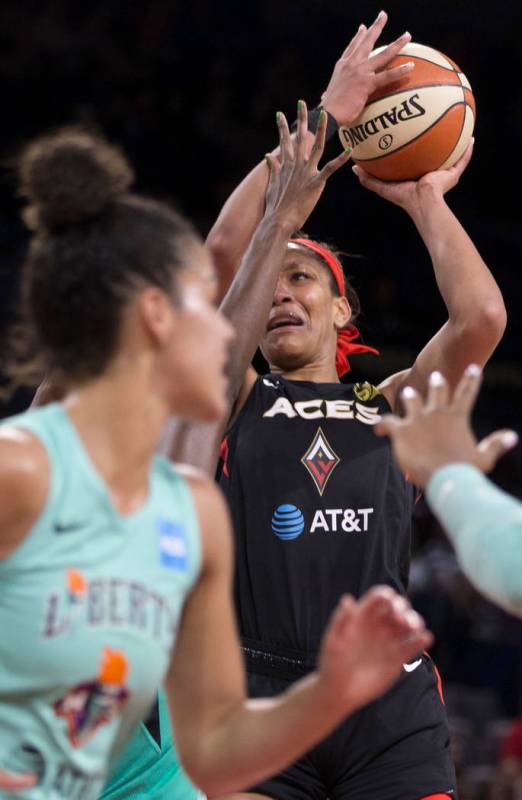 Las Vegas Aces center A'ja Wilson (22) slashes to the rim in traffic in the first quarter durin ...