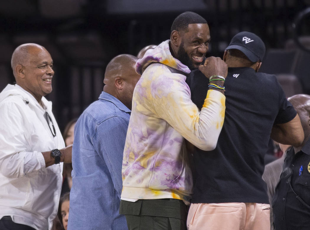 Los Angeles Lakers power forward LeBron James, second from left, greets Oklahoma City Thunder p ...