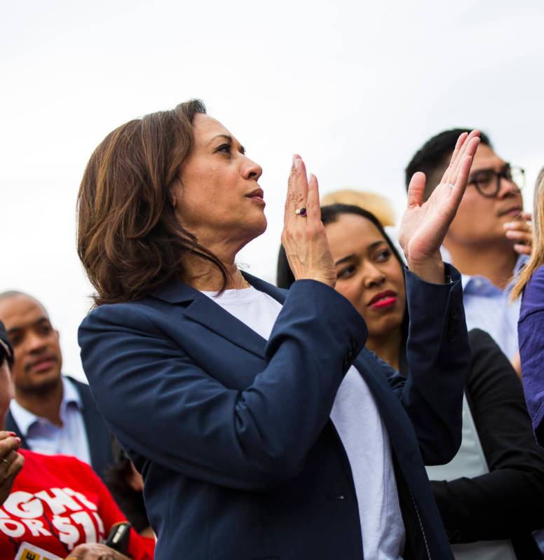 U.S. Sen. Kamala Harris, D-Calif., a Democratic presidential hopeful, claps while listening to ...