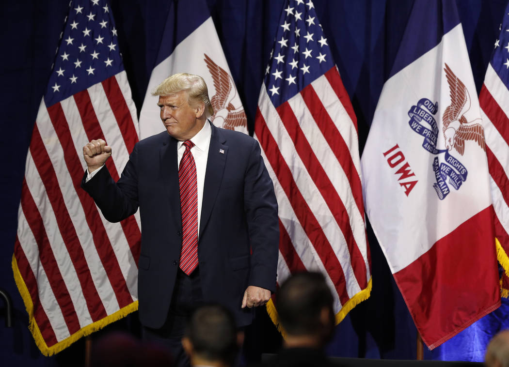 President Donald Trump acknowledges supporters after speaking at the Republican Party of Iowa's ...