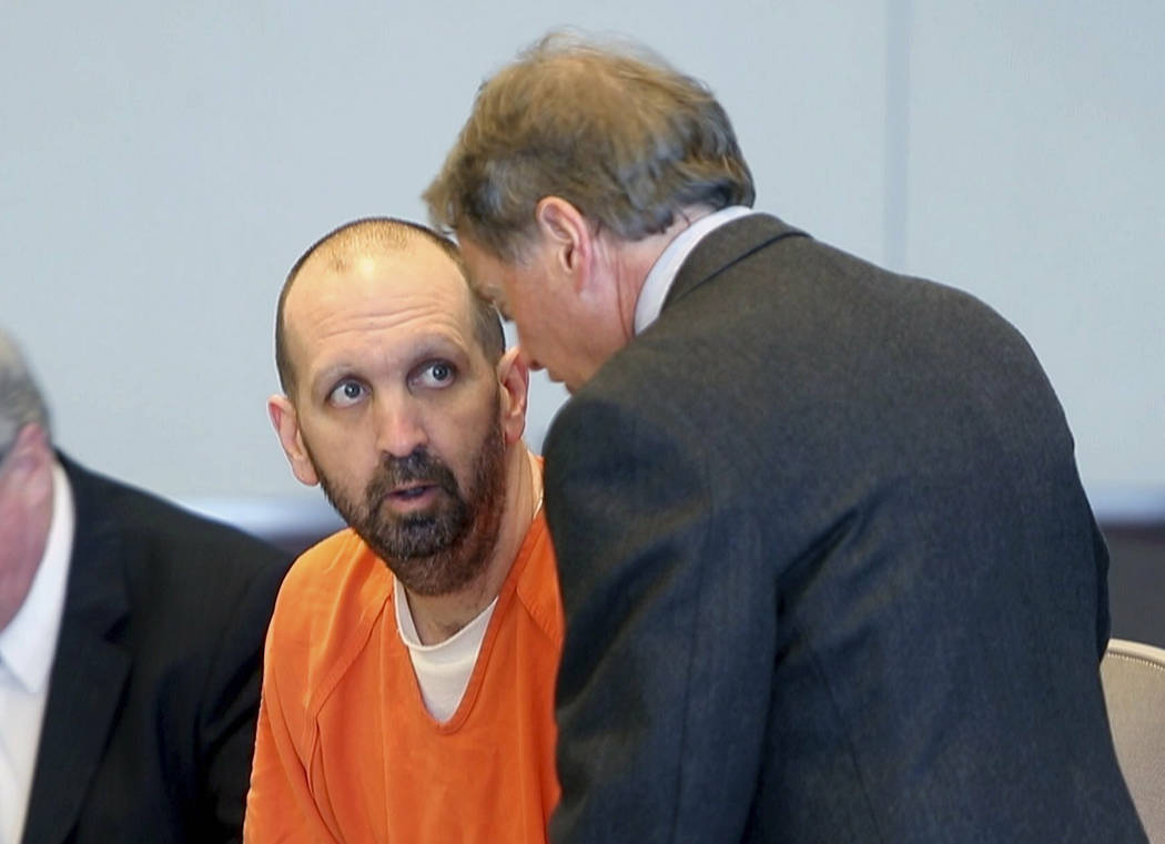 In a March 14, 2017, file photo, Craig Hicks, center, charged with the murder of three Muslim s ...