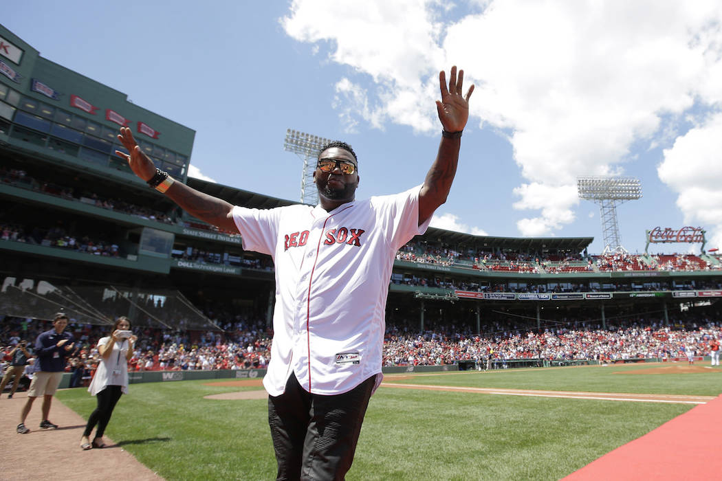 Former Boston Red Sox's David Ortiz waves to the crowd during ceremonies to honor the Red Sox 2 ...