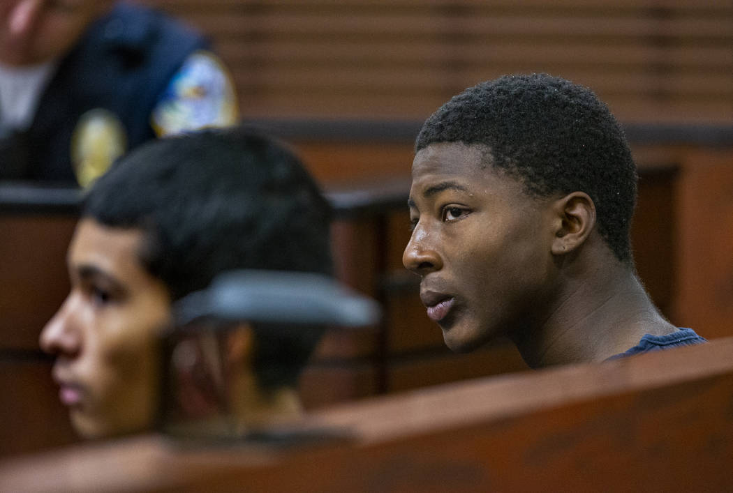 Defendants Josue Turcios and Tahj Simeus wait before the judge while appearing in Henderson Jus ...