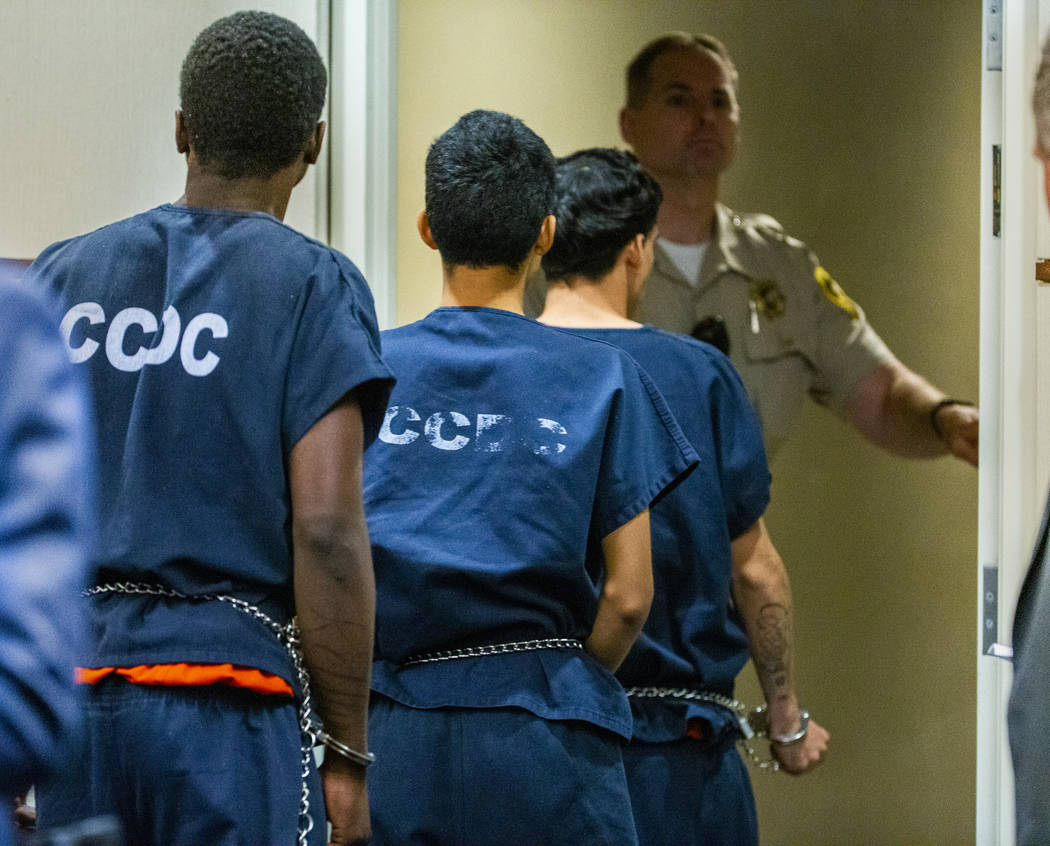 Defendants Tahj Simeus, Josue Turcios and Joseph DeFrancisco leave the courtroom after standing ...