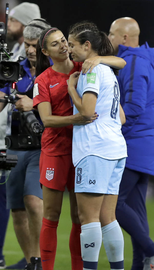 United States' Alex Morgan, left, comforts Thailand's Miranda Nild, right, after the Women's Wo ...