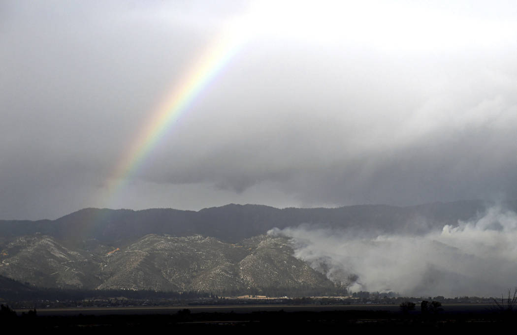 A rainbow arches over the Little Valley Fire in Washoe Lake, Oct. 14, 2016. The state of Nevada ...