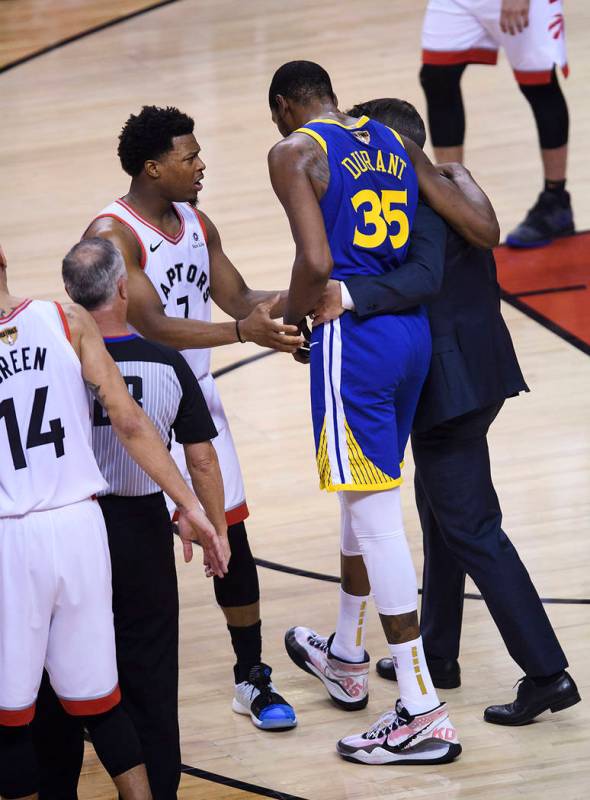 Golden State Warriors forward Kevin Durant (35) leaves after being injured as Toronto Raptors g ...