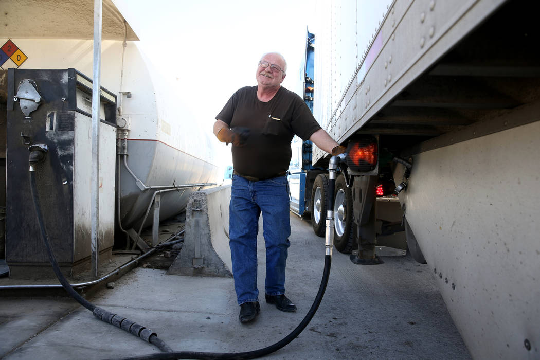 Tony Serpe, a driver trainer with Truline Corporation, fuels up his rig at his trucking company ...