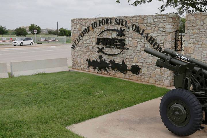 FILE - In this June 17, 2014 file photo, a vehicle drives by a sign at Scott Gate, one of the e ...