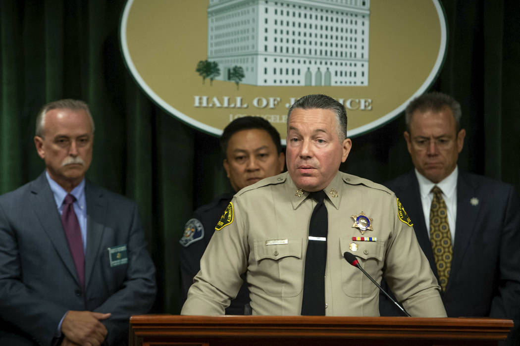 Los Angeles County Sheriff Alex Villanueva, with Sheriff's Homicide Capt. Kent Wegener, from le ...