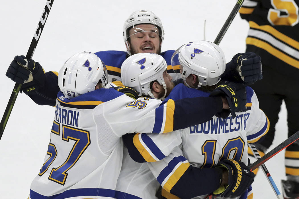 St. Louis Blues' Ryan O'Reilly, center, celebrates his goal with teammates Alex Pietrangelo, le ...