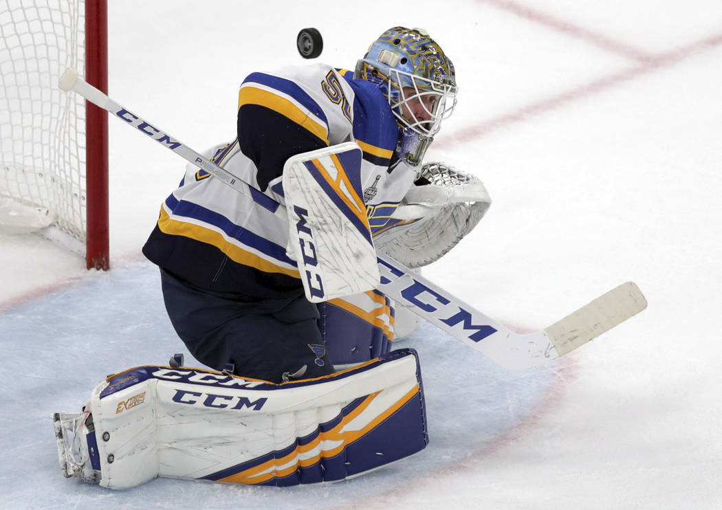 St. Louis Blues goaltender Jordan Binnington turns a shot away during the second period in Game ...