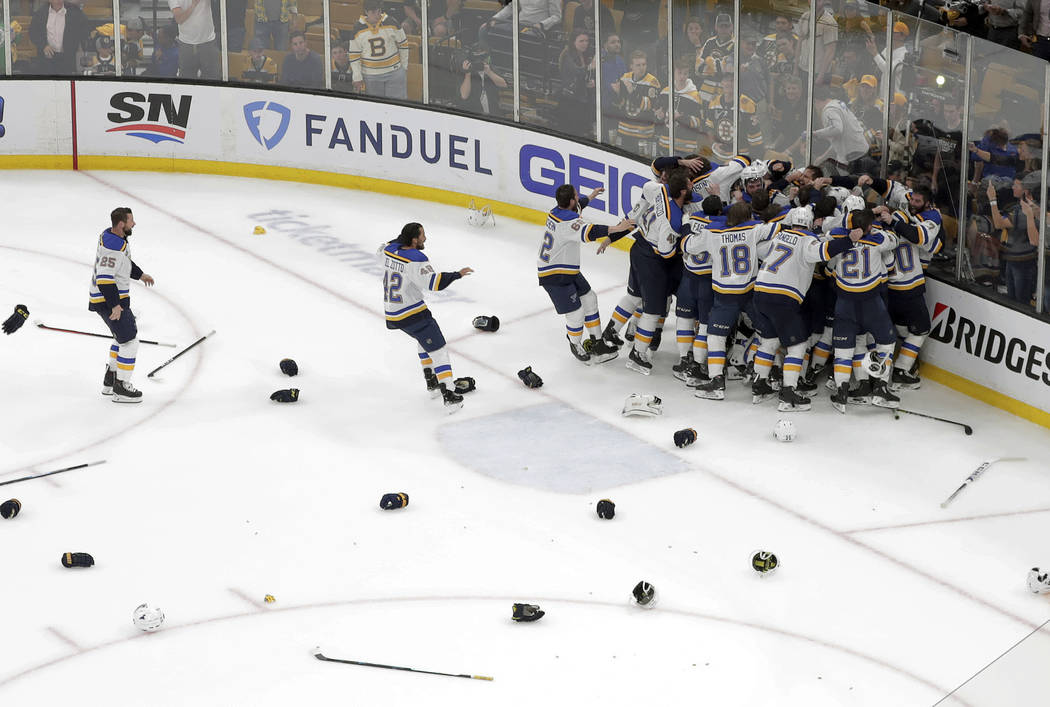 The St. Louis Blues celebrate their win over the Boston Bruins in Game 7 of the NHL hockey Stan ...