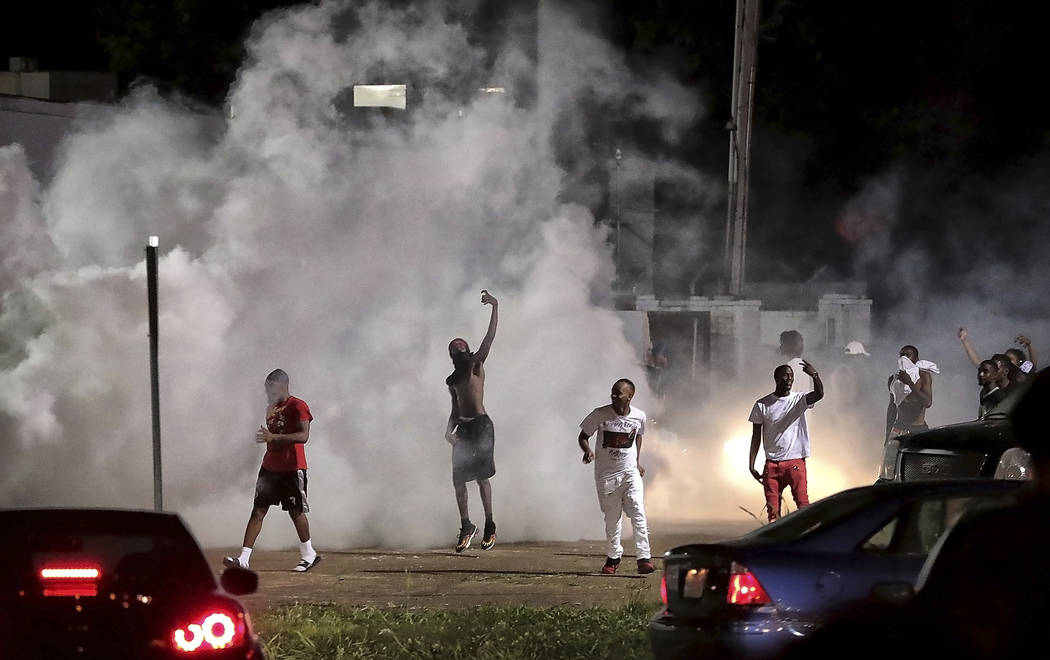 Frayser community residents taunt authorities as protesters take to the streets in anger agains ...