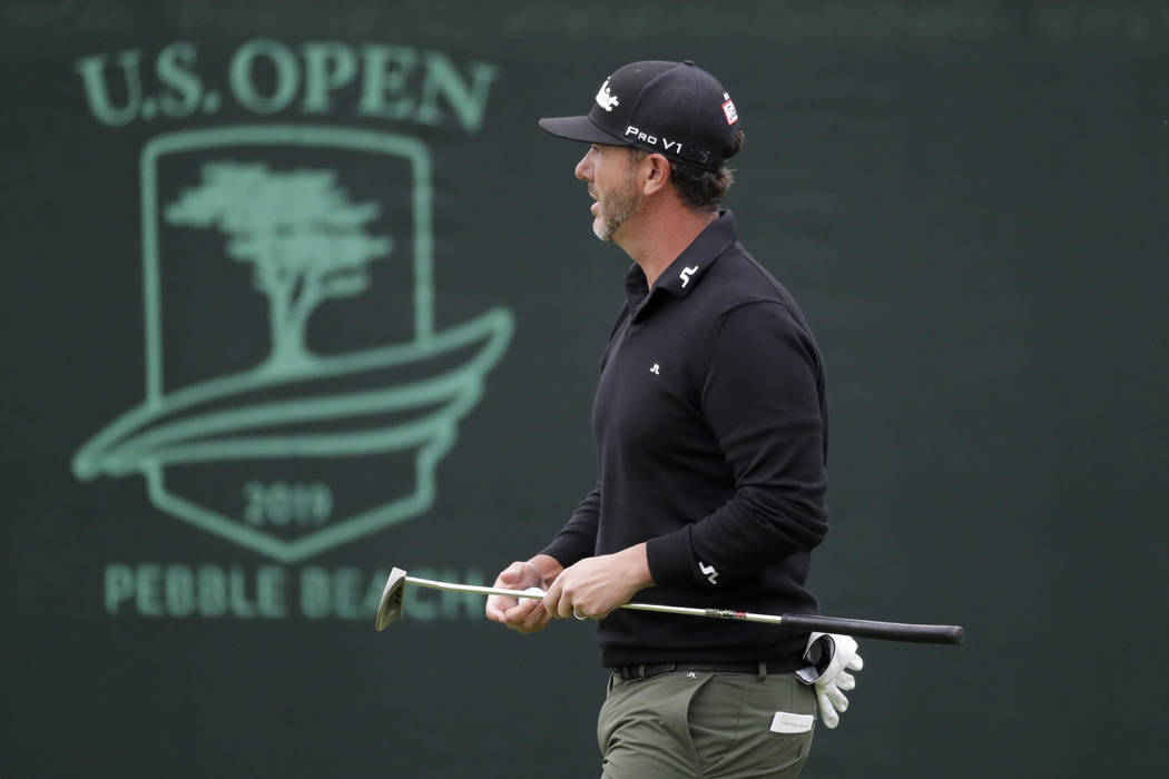 Scott Piercy walks off the third green during the first round of the U.S. Open Championship gol ...