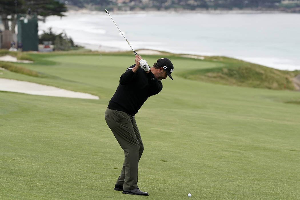 Scott Piercy hits from the fairway on the 10th hole during the first round of the U.S. Open Cha ...