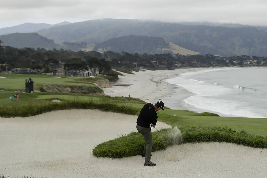 Scott Piercy hits out of the bunker on the ninth hole during the first round of the U.S. Open C ...
