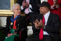 FILE - In a Nov. 24, 2015 file photo, Willie Mays, right, applauds NASA mathematician Katherine ...