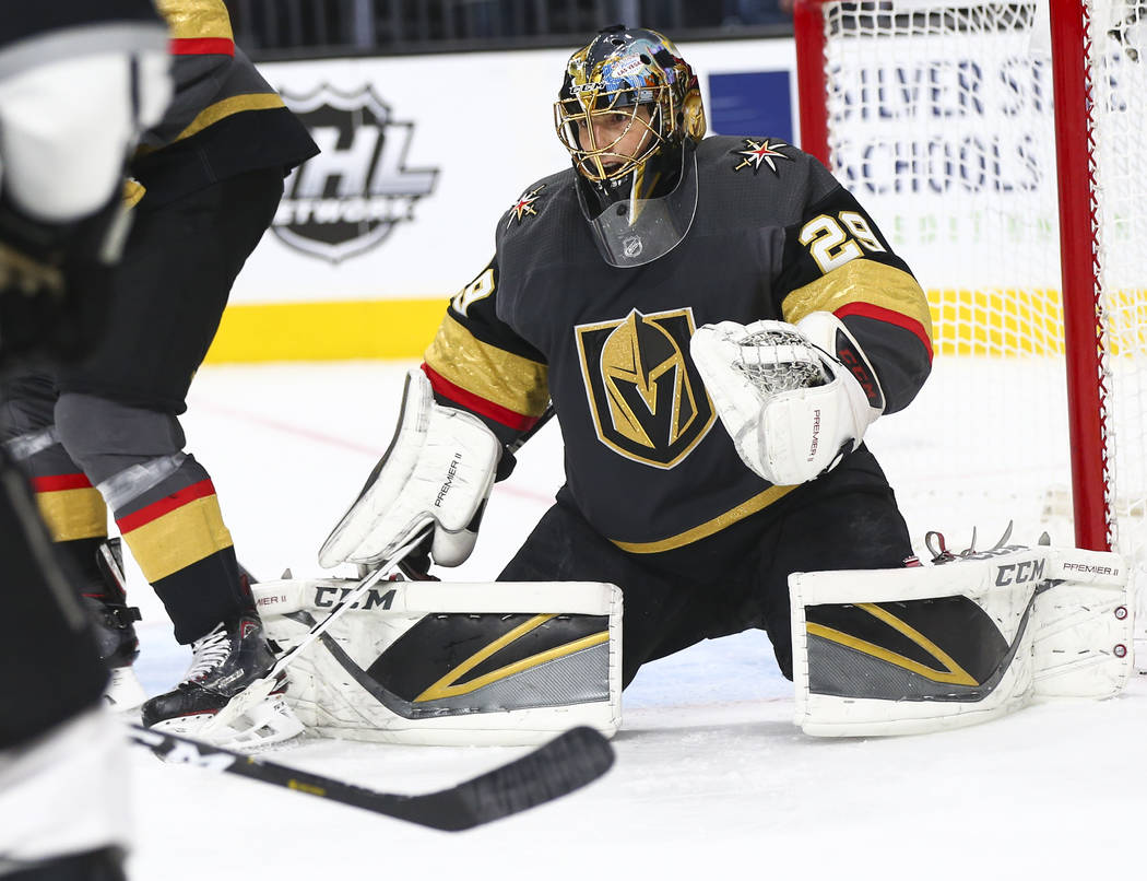 Golden Knights goaltender Marc-Andre Fleury (29) defends the net during the second period of an ...