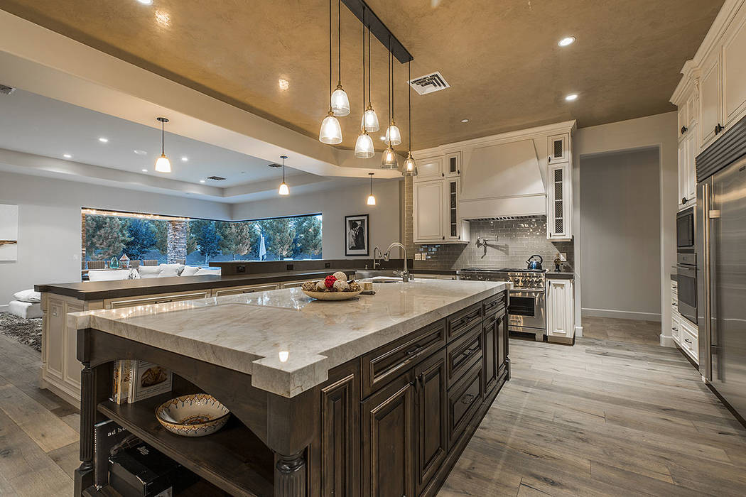 The kitchen has a large center island. (Ivan Sher Group)