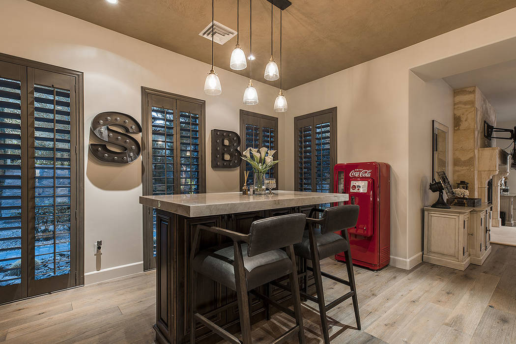 Breakfast nook features an island with seating. (Ivan Sher Group)